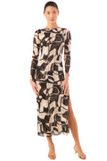 Model wearing a patterned dress on a white background