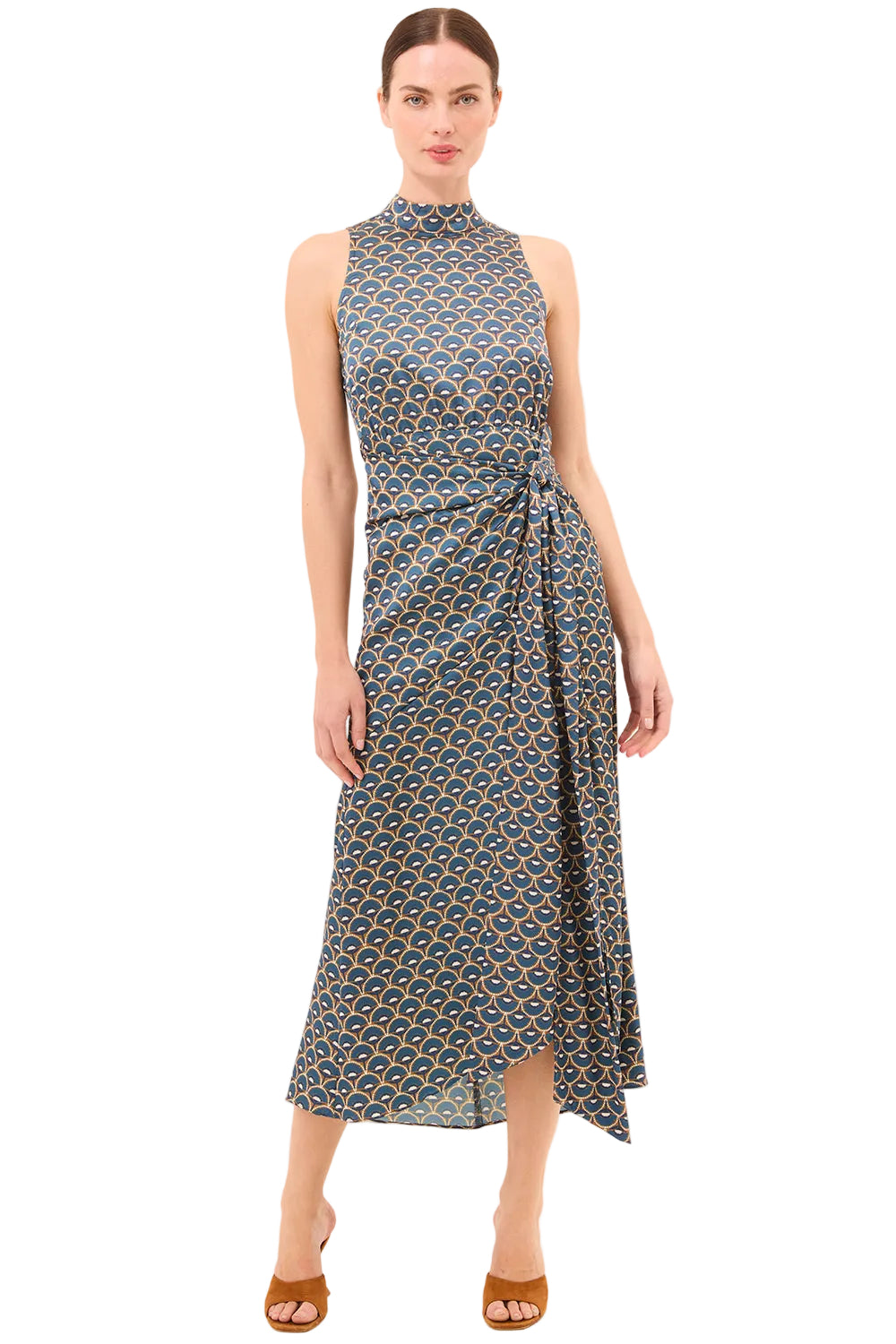 Woman wearing a patterned dress on a beige background