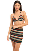 Woman wearing a striped bikini set on a white background